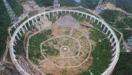File photo taken on July 29, 2015 shows the five-hundred-metre Aperture Spherical Radio Telescope (FAST) under construction in Pingtang, southwestern China's Guizhou province. China OUT / AFP / STR