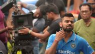 India's cricket captain Virat Kohli reacts during a promotional shoot prior to a training session in Kolkata on September 28, 2016. India take on the visiting New Zealand cricket team in the second Test of the series from September 30 - October 4. (AFP / 