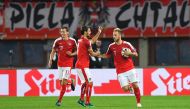 Austria's Marko Arnautovic (R) celebrates his goal to 2:2 with his teammates during the WC 2018 football qualification match between Austria and Wales in Vienna on October 6, 2016. / AFP / JOE KLAMAR
