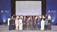 Officials with the graduates at the ceremony.