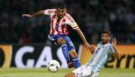 World Cup 2018 Qualifiers - Argentina v Paraguay - Mario Kempes Stadium, Cordoba, Argentina - 11/10/16 - Paraguay's Derlis Gonzalez and Argentina's Mateo Musacchio fight for the ball. Reuters/Marcos Brindicci