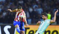 Paraguay’s Derlis Gonzalez (left) vies for the ball with Argentina’s Mateo Mussacchio  during their Russia 2018 World Cup qualifier football match at Alberto Kempes Stadium in  Cordoba, Argentina, on Tuesday.