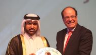 Katara General Manager Dr Al Khalid bin Ibrahim Al Sulaiti (left) presenting the award to Nasser Iraq.