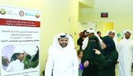 Minister of Public Health H E Dr Hanan Mohamed Al Kuwari with PHCC and HMC officials after inaugurating the immunisation drive yesterday. 