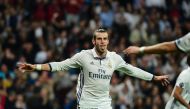Real Madrid's Welsh forward Gareth Bale celebrates after scoring during the UEFA Champions League football match Real Madrid CF vs Legia Legia Warszawa at the Santiago Bernabeu stadium in Madrid on October 18, 2016. (AFP / Pierre-PHILIPPE MARCOU)