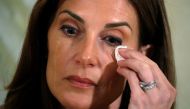 Tears stream down the face of Karena Virginia who claimed to be the victim of sexual assault by Republican presidential candidate Trump back in 1998, during a news conference in the Manhattan borough of New York, New York, U.S., October 20, 2016. (REUTERS