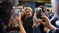 US Democratic presidential nominee Hillary Clinton greets supporters during a campaign rally at Cuyahoga Community College in Cleveland, Ohio, October 21, 2016. / AFP / Robyn Beck