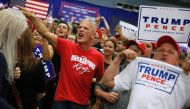 Supporters of Republican US presidential nominee Donald Trump jeer reporters during Trump's remarks to a campaign rally in Newtown, Pennsylvania, U.S. October 21, 2016. Reuters/Jonathan Ernst
