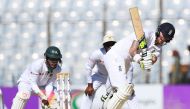 England's Ben Stokes plays a shot during the third day of the first Test match between Bangladesh and England at Zahur Ahmed Chowdhury Cricket Stadium in Chittagong on October 22, 2016 / AFP / Dibyangshu SARKAR
