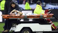 Lyon's French forward Mathieu Valbuena is evacuated by medics during the French L1 football match between Olympique Lyonnais and EA Guingamp on October 22, 2016, at the Parc Olympique Lyonnais in Decines-Charpieu near Lyon, southeastern France. / AFP / PH
