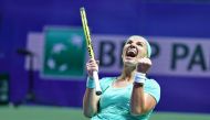 Russia's Svetlana Kuznetsova celebrates after winning against Karolina Pliskova of the Czech Republic in their women's singles match during the WTA Finals tennis tournament on October 26, 2016 in Singapore. (AFP / Roslan Rahman)
