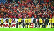 Supporters of China’s Guangzhou Evergrande cheering for their team after the AFC champions league match against Japan’s Urawa Reds in Saitama, Japan in this file photo taken on April 5, 2016.