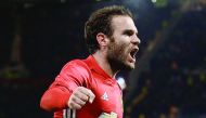 Manchester United’s Spanish midfielder Juan Mata celebrates after scoring a goal against  Manchester City during their English Football League Cup match at Old Trafford in Manchester, England on Wednesday.