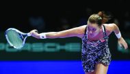Agnieszka Radwanska of Poland in action against Garbine Muguruza of Spain during the Singapore WTA Finals Round Robin Singles at the Singapore Indoor Stadium yesterday.