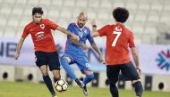 Al Shahaniya's Edu Eduardo Santos (centre) vies for the ball possession against two Al Rayyan players during their Qatar Stars League game at the Jassim Bin Hamad Stadium in this August 17 file photo.