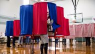 New Hampshire citizens cast their vote at Amherst Street Elementary School on November 8, 2016, in Nashua, New Hampshire. Americans today will choose between Republican presidential candidate Donald Trump and Democratic presidential candidate Hillary Clin