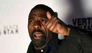 Idris Elba poses as he arrives for the UK premiere of 
