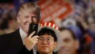 A man takes a selfie with a cut-out of Republican U.S. presidential nominee Donald Trump during a U.S. Election Watch event hosted by the U.S. Embassy at a hotel in Seoul, South Korea, November 9, 2016. REUTERS/Kim Hong-Ji