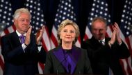 Hillary Clinton addresses her staff and supporters about the results of the U.S. election as former U.S. President Bill Clinton (L) and her running mate Tim Kaine applaud at a hotel in the Manhattan borough of New York, U.S., November 9, 2016. REUTERS/Car