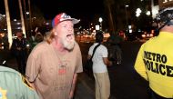 A Donald Trump supporter yells at anti-Trump protesters outside the Trump International Hotel & Tower Las Vegas on November 12, 2016 in Las Vegas, Nevada. The election of Trump as president has sparked protests in cities across the country. (Ethan Miller/