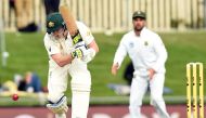 Australia's batsman Steven Smith plays a shot on the third day's play of the second Test cricket match between Australia and South Africa in Hobart on November 14, 2016. (AFP / SAEED KHAN)
