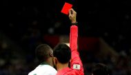 Saudi Arabia's Osama Hawsawi is shown a red card by referee Muhammad Taqi. REUTERS/Toru Hanai