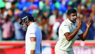 India's Ravichandran Ashwin (right) celebrates the dismissal of England's Joe Root during their second Test cricket match at Dr. YS Rajasekhara Reddy ACA-VDCA Cricket Stadium in Visakhapatnam, India yesterday.
