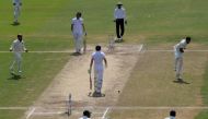 India's Umesh Yadav (R) celebrates the wicket of England's Jonny Bairstow (C) with captain Virat Kohli (L) and teammates during the third day of the second Test cricket match between India and England at the Dr. Y.S. Rajasekhara Reddy ACA-VDCA Cricket Sta