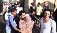  An Egyptian woman hugs a youth who was released from the capital Cairo's Tora prison on November 18, 2016. Egypt released today 82 detainees, more than 30 of them students, after a pardon was issued a day earlier by President Abdel Fattah al-Sisi followi
