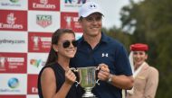 US golfer Jordan Spieth poses with the Stonehaven Cup amd his girlfriend Annie after winning the Australian Open golf tournament at the Royal Sydney Golf Club in Sydney on November 20, 2016. (AFP / PETER PARKS)