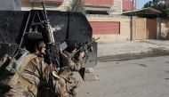 An Iraqi special forces soldier fires his rifle after an Islamic State suicide car bomb attack against Iraqi special forces during clashes in Mosul, Iraq, November 19, 2016. REUTERS/Goran Tomasevic
