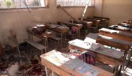 An image shows a pool of blood and damage at a classroom after it was reportedly hit by rebel rocket fire in the Furqan neighbourhood of the government-held side of west Aleppo, on November 20, 2016. / AFP.