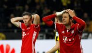 Robert Lewandowski (L) and Thomas Mueller(R) of Bayern Munich react during the Bundesliga soccer match between Borussia Dortmund and Bayern Munich at the Signal Iduna Park in Dortmund, Germany on November 19, 2016. Leon Kuegeler - Anadolu Agency 
