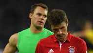 Bayern Munich's midfielder Thomas Mueller (R) and Bayern Munich's goalkeeper Manuel Neuer react after the German first division Bundesliga football match between Borussia Dortmund and FC Bayern Munich in Dortmund on November 19, 2016.  AFP / PATRIK STOLLA