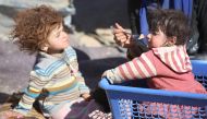 Children are seen as the internally relocated people, who fled their homes due to the clashes, wait to be placed to refugee camps, at Omerkapci village of Bashiqa town in Mosul, Iraq on November 20, 2016 as the operation to liberate Iraq’s Mosul from IS c