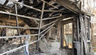 Really Golan inspects the damage at her house, which burned during a wildfire caused by dry conditions, on November 23, 2016 in the northern Israeli town of Zikhron Ya'aqov. In Zikhron Ya'aqov, more than ten homes were burnt and several people have been l