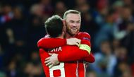 Manchester United's Wayne Rooney celebrates with Juan Mata after scoring a goal against Feyenoord during their UEFA Europa League match at Old Trafford in Manchester, England on Thursday.