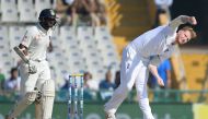 England bowler Ben Stokes (R) bowls as Indian batsman Parthiv Patel looks on during second day of the third Test cricket match between India and England at The Punjab Cricket Association Stadium in Mohali on November 27, 2016. GETTYOUT / AFP / SAJJAD HUSS