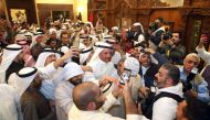 Kuwaiti candidate and former parliament speaker Marzouq al-Ghanem (C), celebrates with his supporters following the announcement of his victory in the parliamentary election, in Kuwait city, early November 27, 2016. AFP / Yasser Al-Zayyat