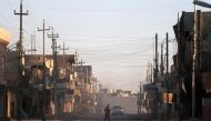 A man walks across a street in Qaraqosh, east of Mosul, Iraq November 25, 2016. Picture taken November 25, 2016. REUTERS/Goran Tomasevic

