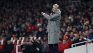 Arsenal's French manager Arsene Wenger shouts instructions to his players from the touchline during the EFL (English Football League) Cup quarter-final football match between Arsenal and Southampton at the Emirates Stadium in London on November 30, 2016. 