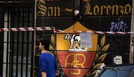 A graffiti dedicated to AS Roma's football club is seen in the San Lorenzo district, on October 24, 2016 in Rome. Rome's football teams will play their derby Lazio vs AS Roma on December 4, 2016. / AFP / FILIPPO MONTEFORTE
