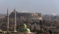 A general view shows rising smoke after strikes near Aleppo citadel in Aleppo city, Syria December 3, 2016. REUTERS/Omar Sanadiki 
