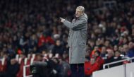 Arsenal's French manager Arsene Wenger shouts instructions to his players from the touchline during the EFL (English Football League) Cup quarter-final football match between Arsenal and Southampton at the Emirates Stadium in London on November 30, 2016. 