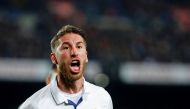 Real Madrid's defender Sergio Ramos celebrates after scoring the equalizer during the Spanish league football match FC Barcelona vs Real Madrid CF at the Camp Nou stadium in Barcelona on December 3, 2016. AFP / PAU BARRENA