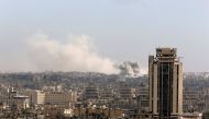 A general view shows rising smoke after strikes on Aleppo city, Syria December 3, 2016. REUTERS/Omar Sanadiki