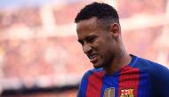 Barcelona's Brazilian forward Neymar reacts after a collision with Real Madrid's defender Dani Carvajal during the Spanish league football match FC Barcelona vs Real Madrid CF at the Camp Nou stadium in Barcelona on December 3, 2016. / AFP / JOSEP LAGO
