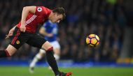 Manchester United's English defender Phil Jones chases the ball during the English Premier League football match between Everton and Manchester United at Goodison Park in Liverpool, north west England on December 4, 2016. (AFP / Paul ELLIS)
