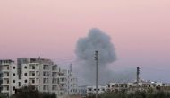 Smoke rises after war crafts belonging to the Assad Regime forces carried out airstrike over residential areas at Maarrat Misrin town of Idlib, Syria on December 6, 2016. (Bahjat Najar / Anadolu Agency)