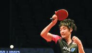 Japan's Yuto Muramatsu returns the ball to Vladimir Samsonov of Belarus, during their Men's singles pre-quarter-final game of the Seamaster ITTF World Tour Finals at the Ali Bin Hamad Al Attiyah Arena in Doha yesterday. Muramatsu shocked the European gian